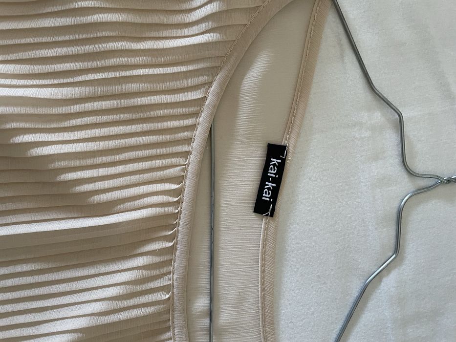 Blusa assimetrica plissada