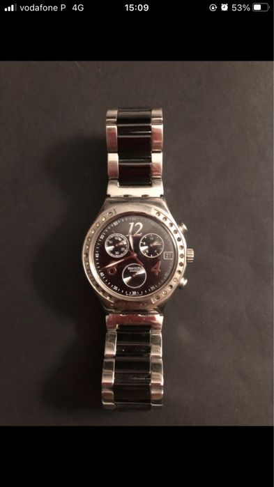 Relógio Swatch Irony , fundo preto, pulseira em aço