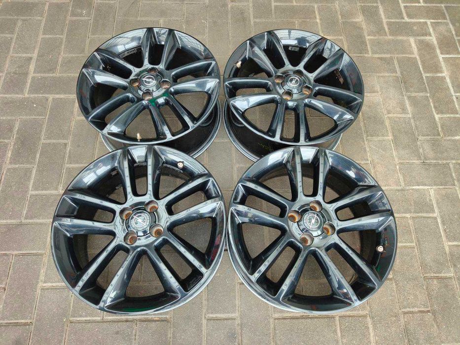 4x100 Alufelgi R17 OPEL CORSA D E Astra H Combo Tigra Meriva Fiat Grande Punto ET44 7j 4szt Oryginał