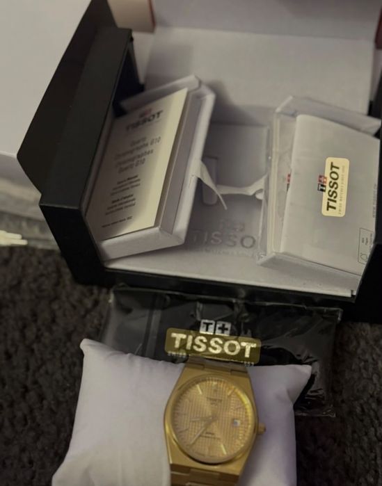 Relógio tissoft dourado