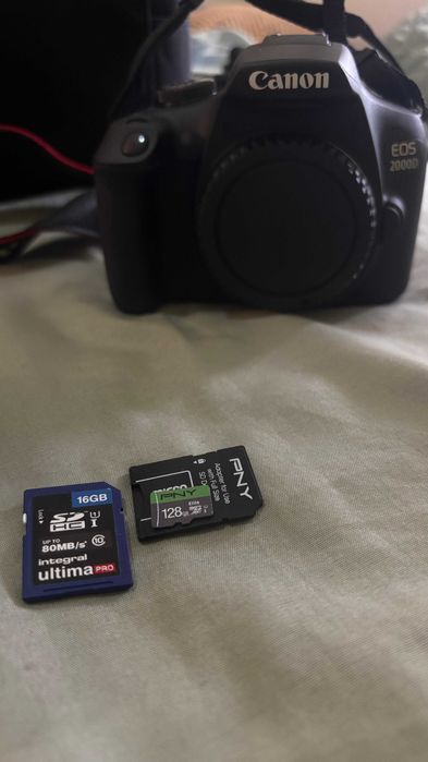 Câmera Fotográfica 2000D NOVA + Extra: Bateria, Tripé e Micro SD 12864552894698755123