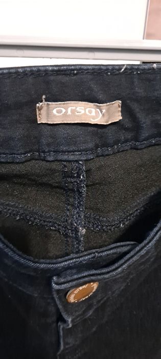 Granatowe  spodnie jeansowe z dziurami  Orsay r 38