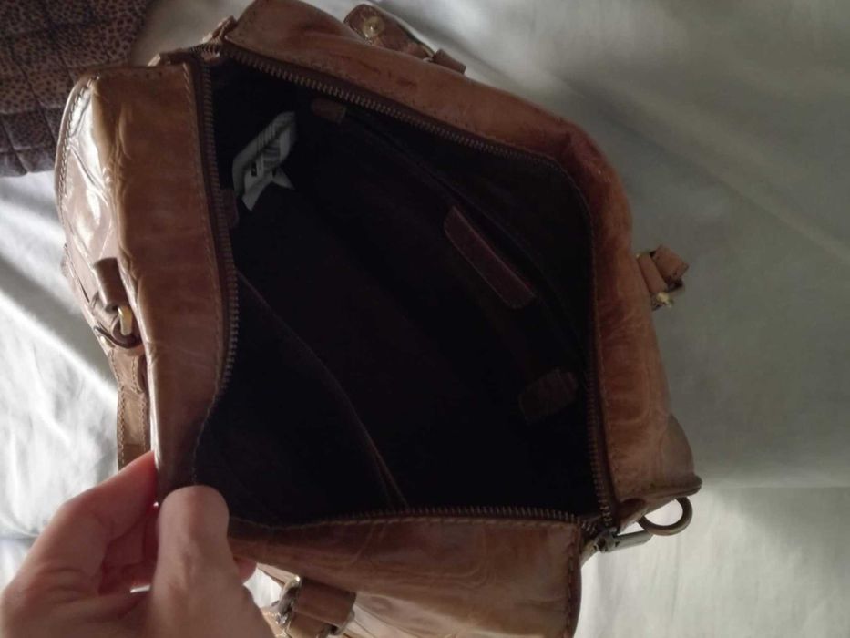 Mala castanha em pele