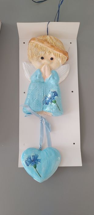 Anioł ze szczęścia ulepiony chłopiec. Komunia chrzciny