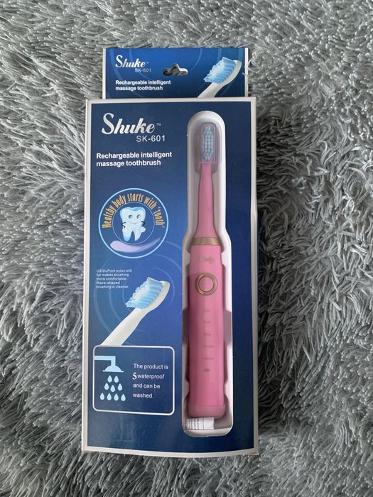 Елетрична зубна щітка на акумуляторі з трьома насадками рожева