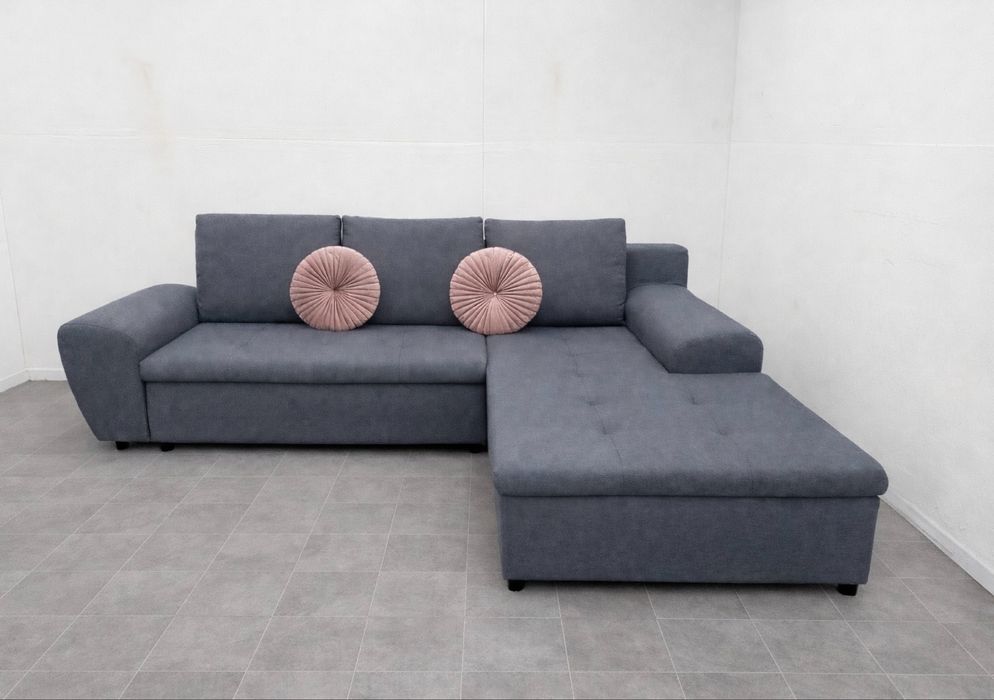 Szary narożnik rozkładany z funkcją spania używany transport