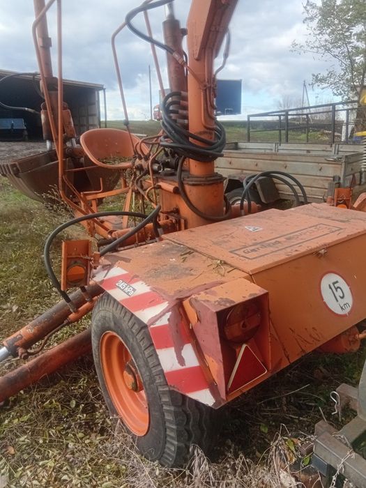 Грейферний навантажувач,причіпний