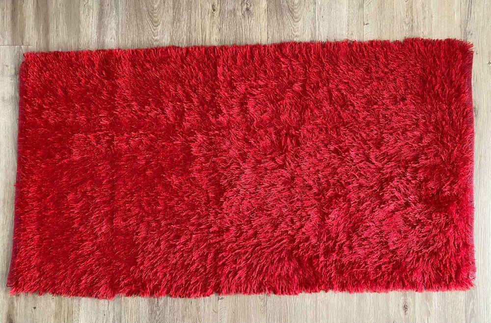 Long-pile red rug in good condition