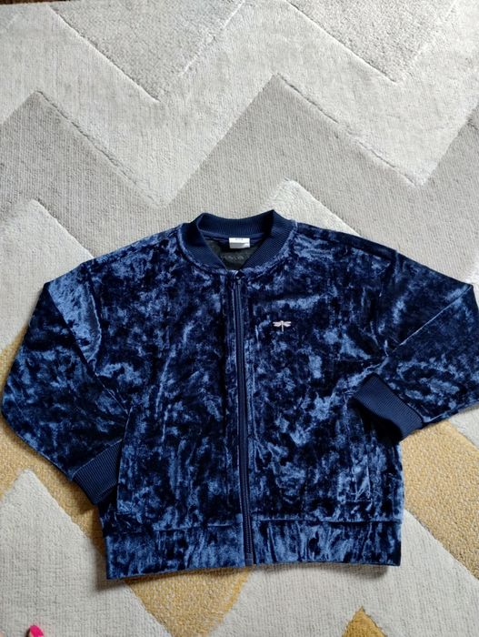 Rozpinana bluza dla dziewczynki z błyszczącego materiału r. 104