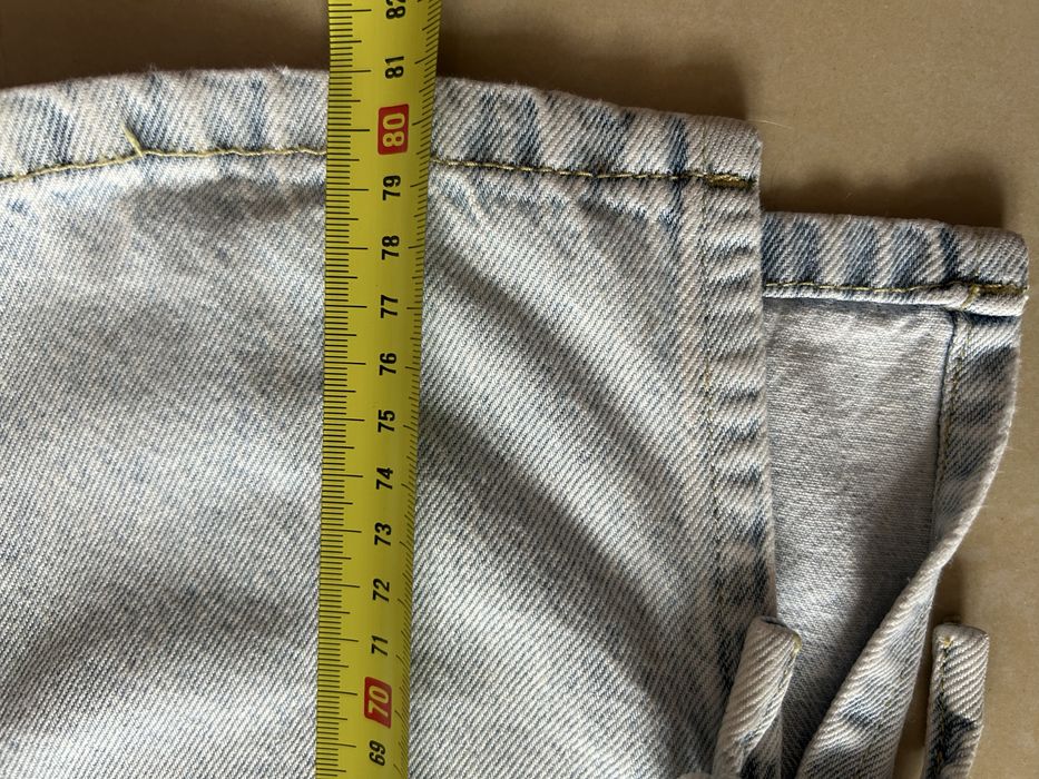 Jeansy Reserved z kokardkami rozm 140