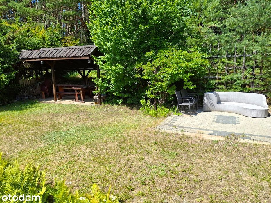 Domek letniskowy z sauną nad jeziorem, 1100m² ogrodzonego terenu.