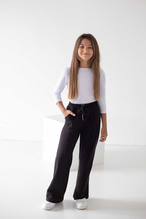 Чорні штани для дівчинки розмір 134