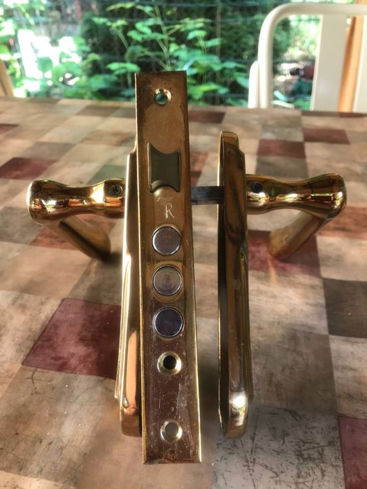 Дверні двосторонні ручки золотого кольору