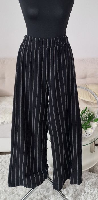 Spodnie szerokie nogawki H&M".