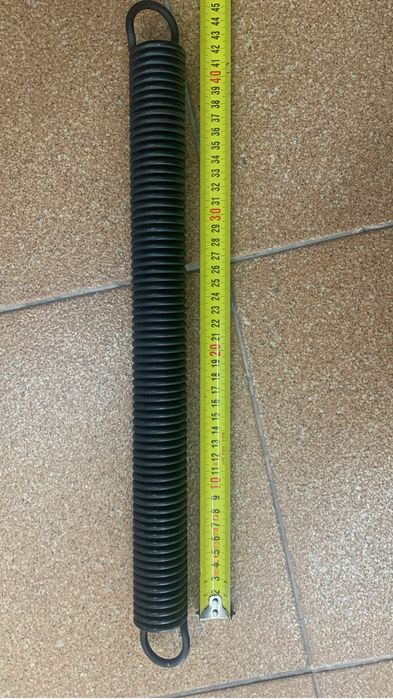 Mola em aço para porta basculante