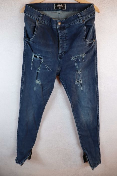 Siksilk męskie spodnie jeansy skinny fit stretch z dziurami z niskim krokiem rurki M W32