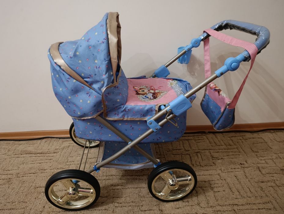 Дитяча іграшкова коляска
