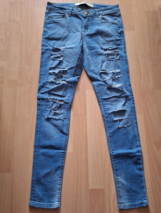Spodnie damskie jeansy z dziurami 36 S