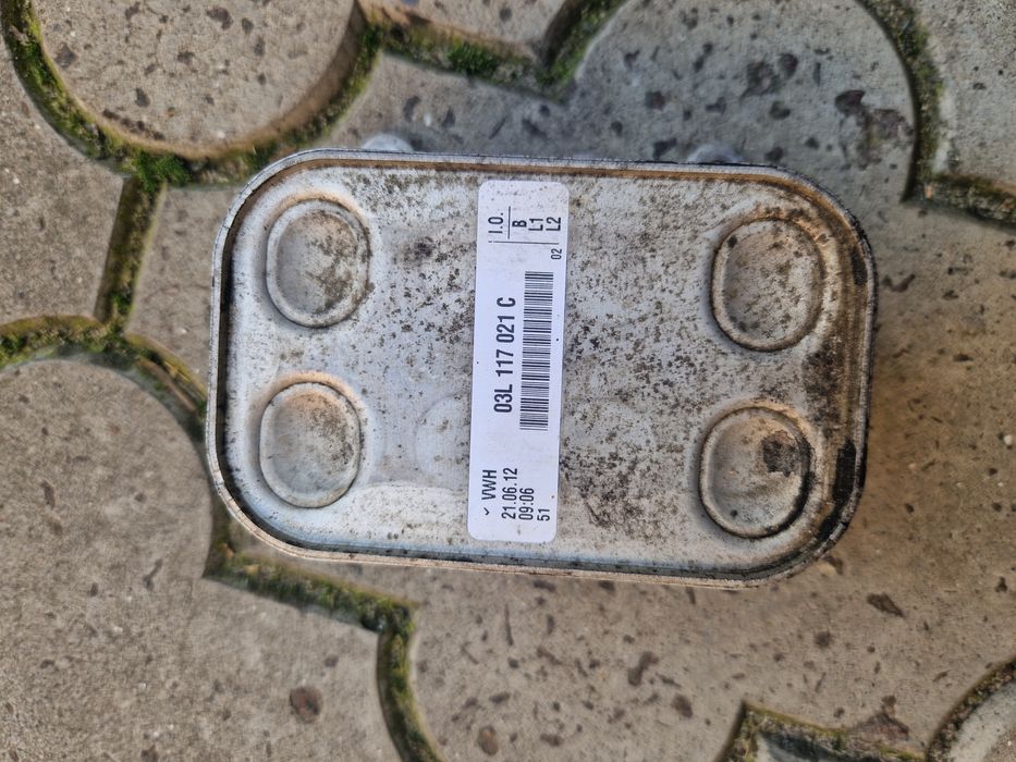 03L117021C VAG радиатор масляный (холодильник, под фильтром)