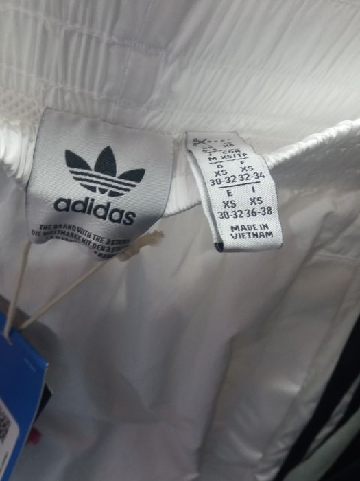 Оригінал спортивні штани Joggers TEAMGEIST TP JD0257 Donna Bianc  жіночі XS  білі спортивні повсякденні логотип оригінал смужки літо осінь демісезон