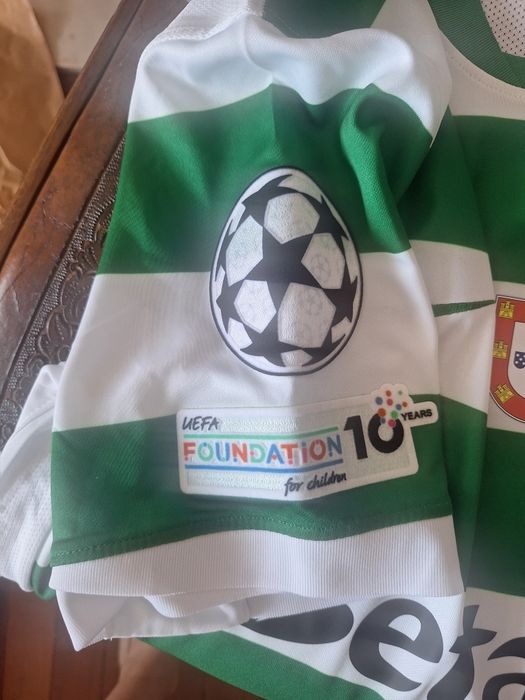 Camisola Sporting CP 25/26 bacdge e champions
