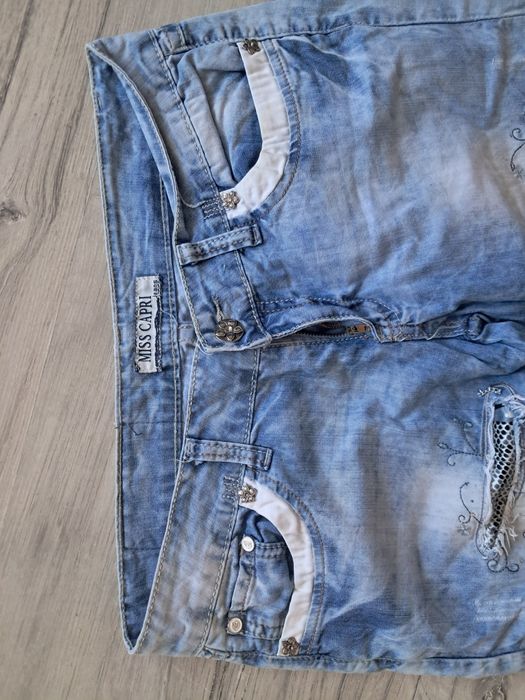 Spodnie jeans z dodatkami damskie
