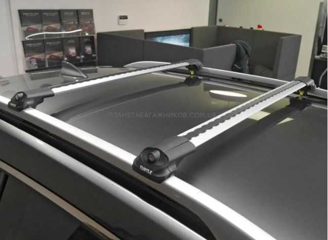 Поперечини Turtle AIR1 на високі рейлінги багажник
