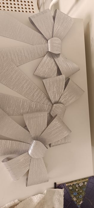 3 laços prateados, de Natal