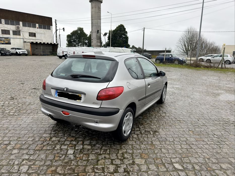 100 mil kms 206 comoletamente nova