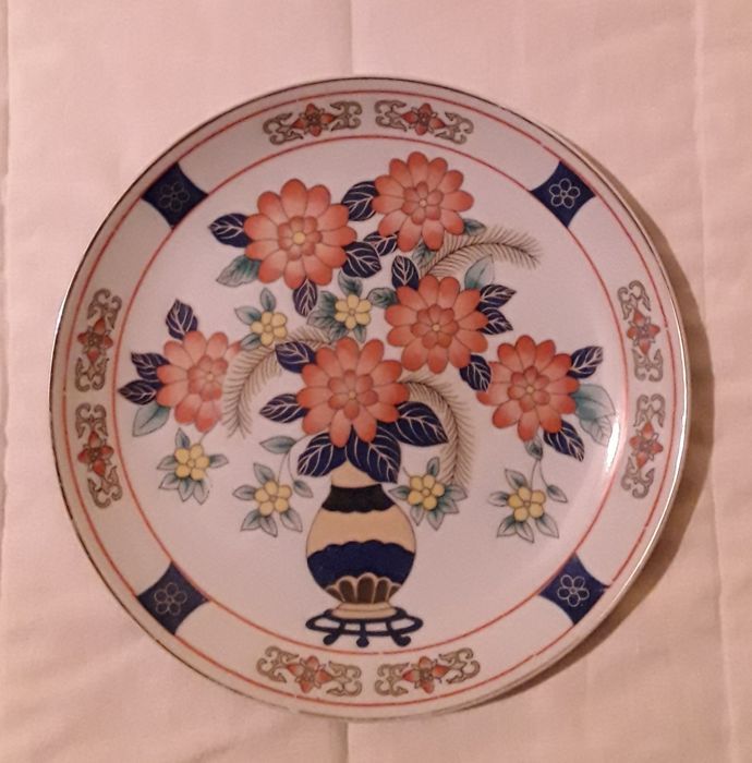 Prato decorativo com flores laranjas com 22 cm