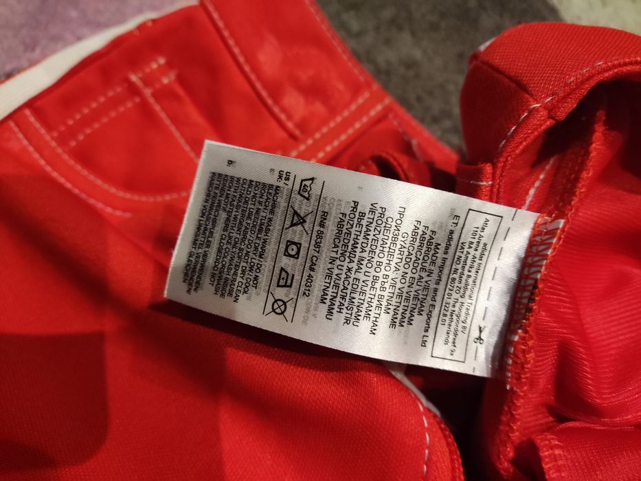 Spodnie adidas fiorucci czerwone.