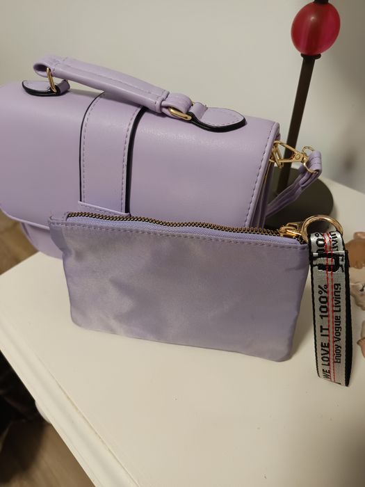 Mala de mão e a tiracolo e porta moedas