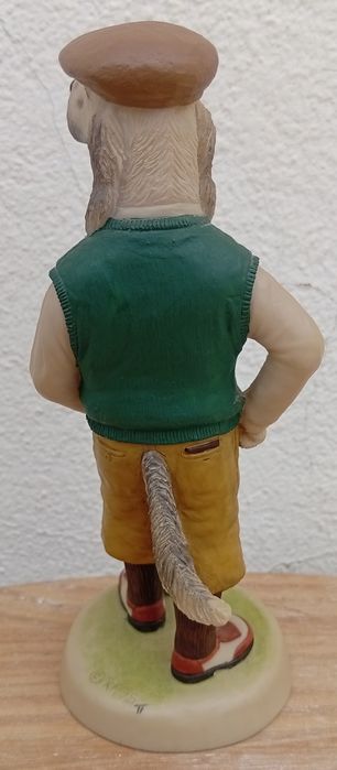 Estatueta de um cão golfista