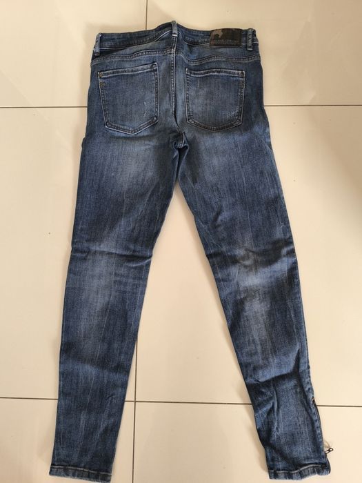 Spodnie z dziurami, jeansy damskie Zara 38