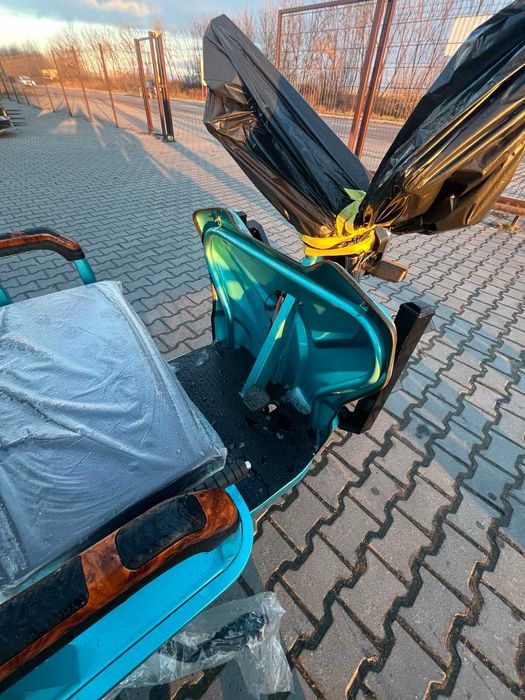 Самосвальний електричний трицикл.