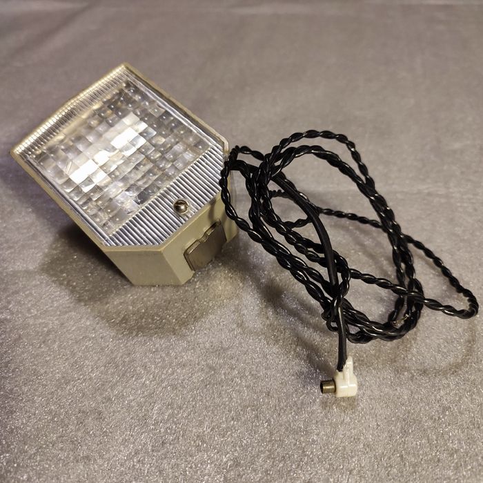 Запчасть для фотовспышки.