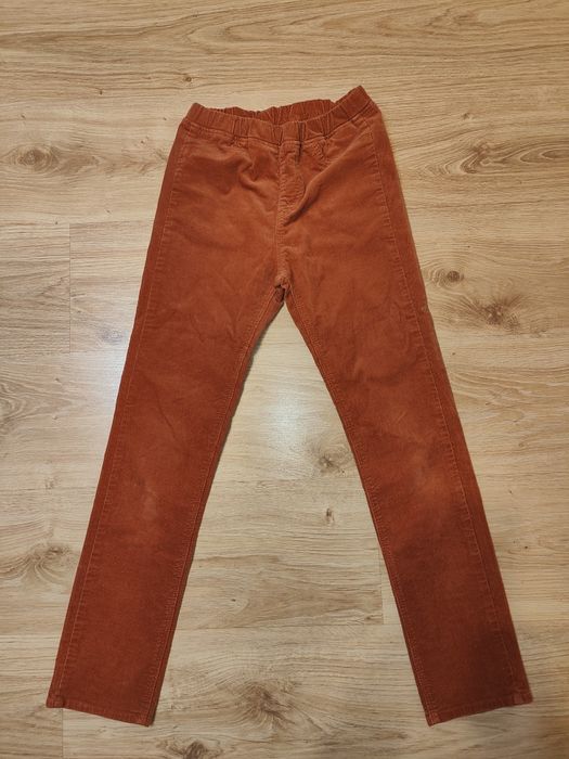 Spodnie sztuksowe w kolorze ceglastym w rozmiarze 144 cm długosci