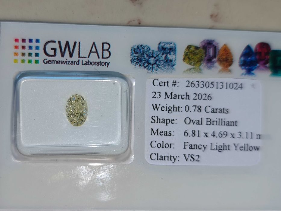 Naturalny diament 0.78 Ct Fancy Light Yellow VS2- certyfikat