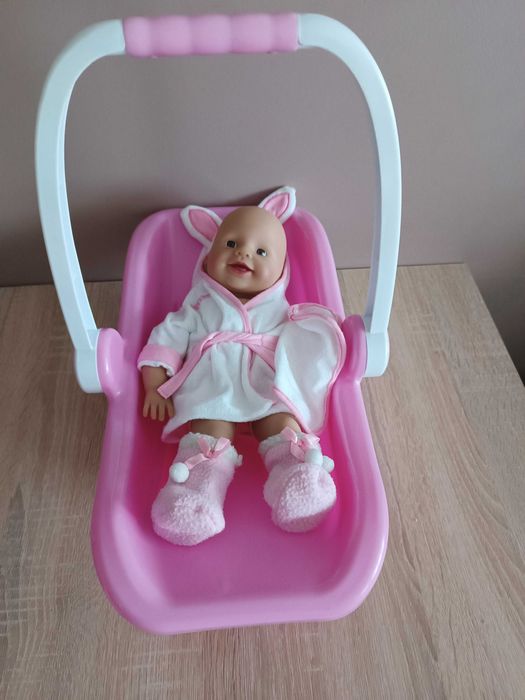 Lalka bobas, nosidełko i ubranka.