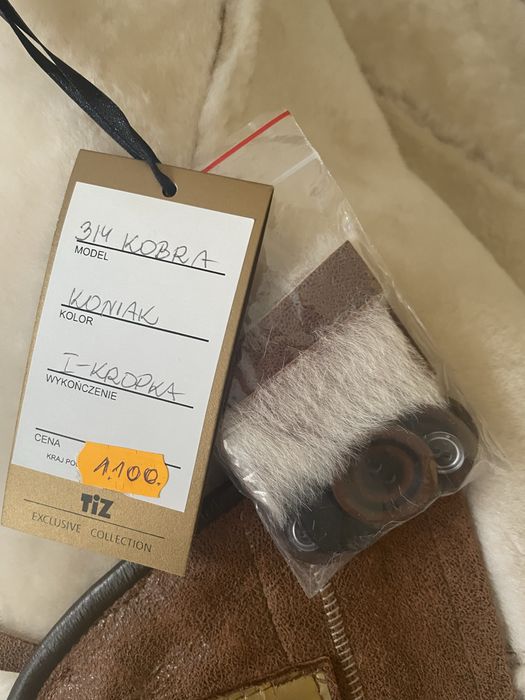 Nowy kożuch z kapturem, rozmiar 46/48 kolor koniak;eksluzywna kolekcja