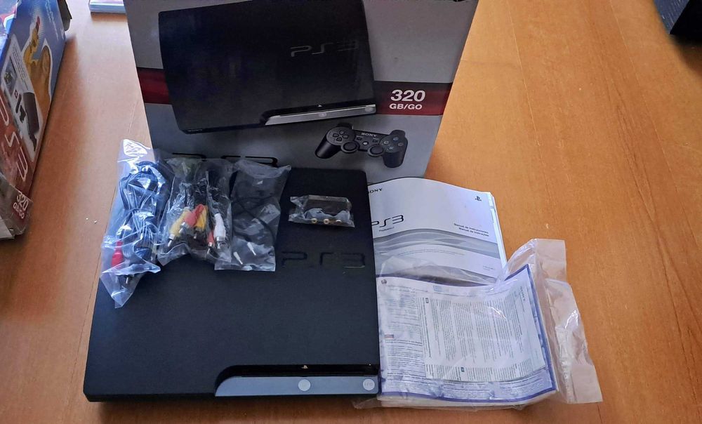 PS3 com jogos, comandos e câmara