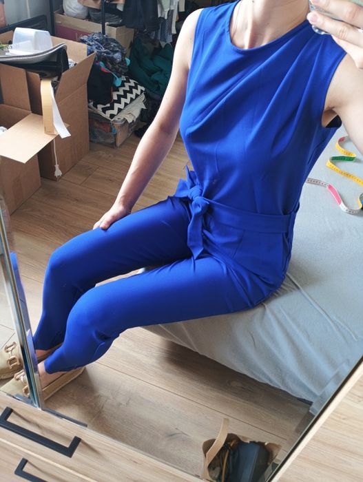 Zadbany granatowy kombinezon rozmiar S