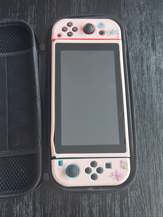 Nintendo Switch 1.1 + 2 jogos (Zelda e Pokémon)