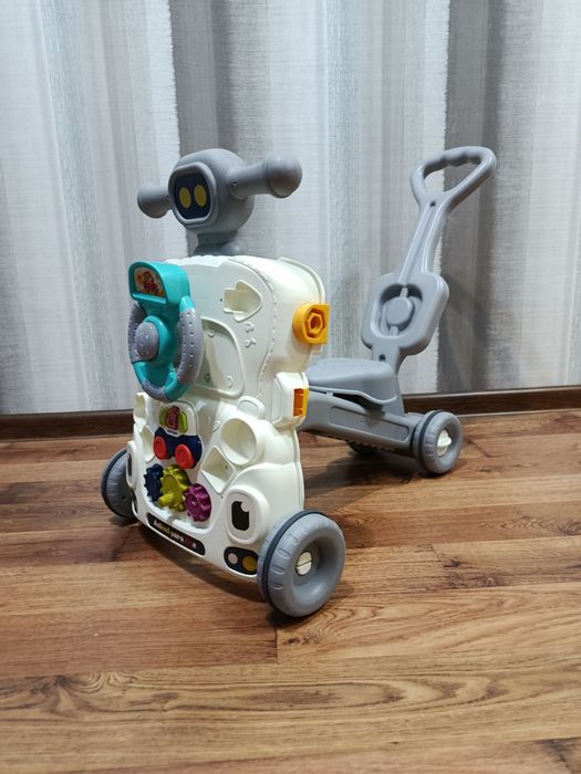 Музичні ходунки толокар каталка гойдалка, столик розвиваючий