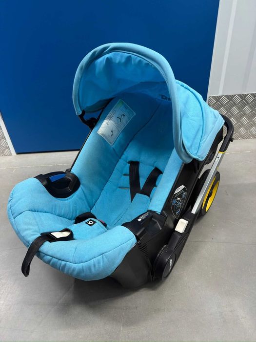 Doona+  Pack Completo: Base Isofix + Mala Oficial + Capa Chuva