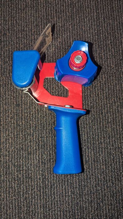 Dyspenser do taśmy pakowej klejącej