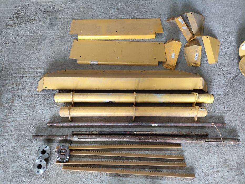 Wał listwy osłony podajnika New Holland 8040, 8050, 8060, 8070, 8080