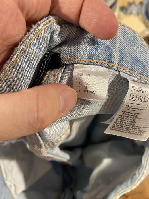 Jasnoniebieskie dżinsy z dziurami baggy spodnie denim quiet luxury paryski styl HM Studio
