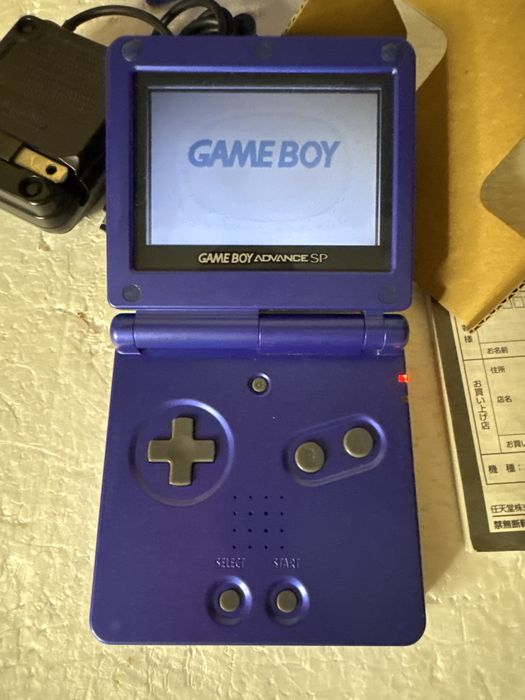 Konsola Nintendo Game Boy Advance SP - niebieska, w pudełku z ładowarką, grą i instrukcją