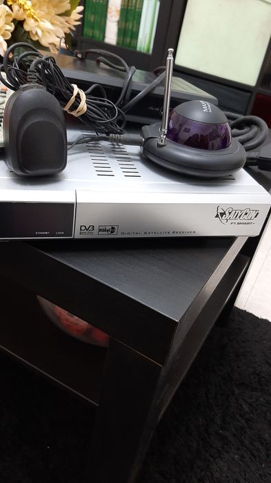 Satellite dish device with channel-changing transmitter64739758664449122